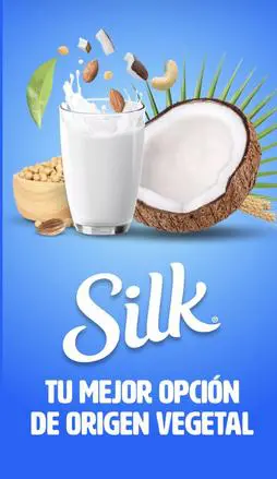 Glass of plant-based milk, coconut half, almonds, and soybeans on a blue background with the text "Silk: Tu mejor opción de origen vegetal.