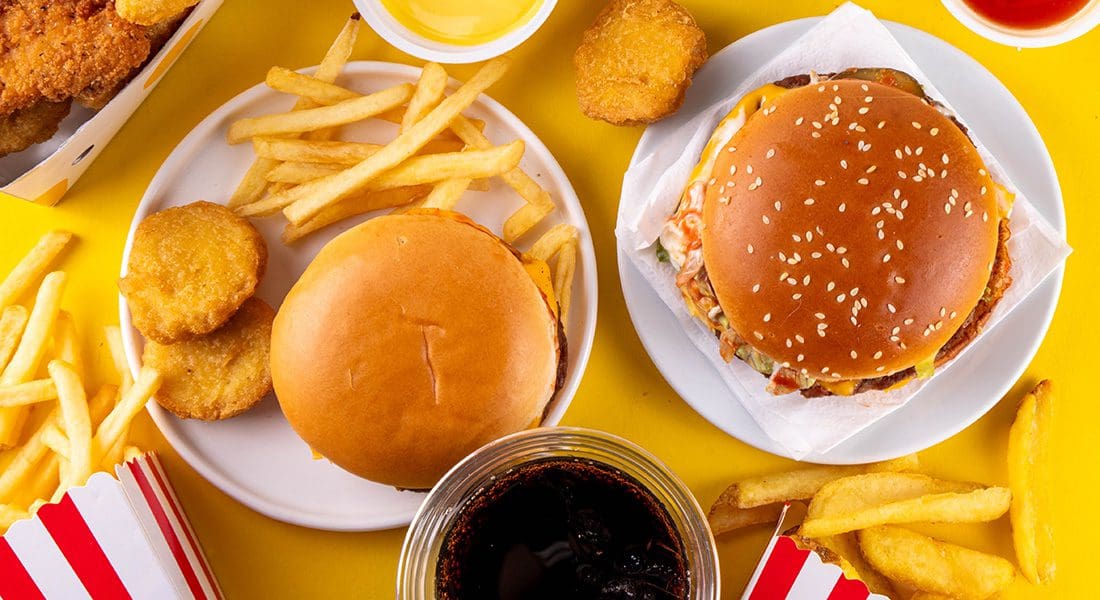 Fast food meal with burgers and fries.